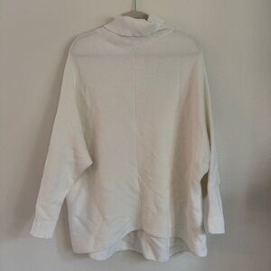 Oversized white turtleneck sweater